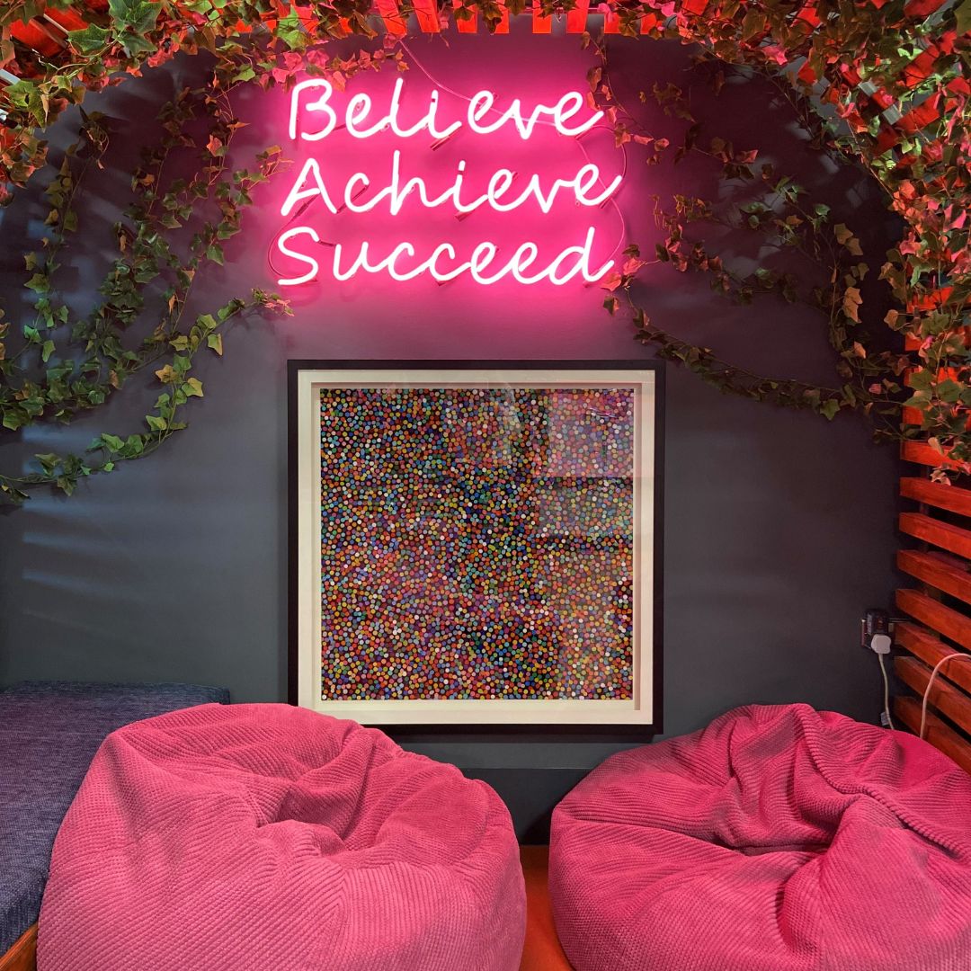 neon sign, bean bags and art at CEL Solicitors