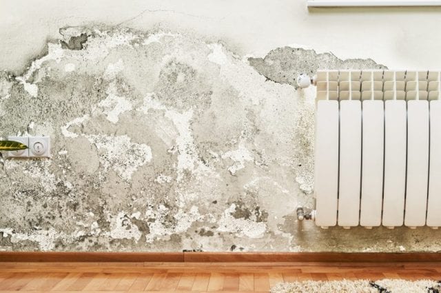 Damage caused by damp on a wall in modern house